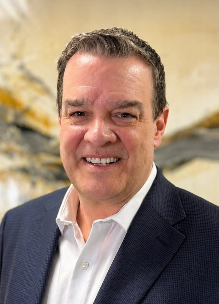 Matthew Brooks LSW, smiling and dressed in a dark blazer, against a neutral background, representing Bergen County Therapists' mental health services.