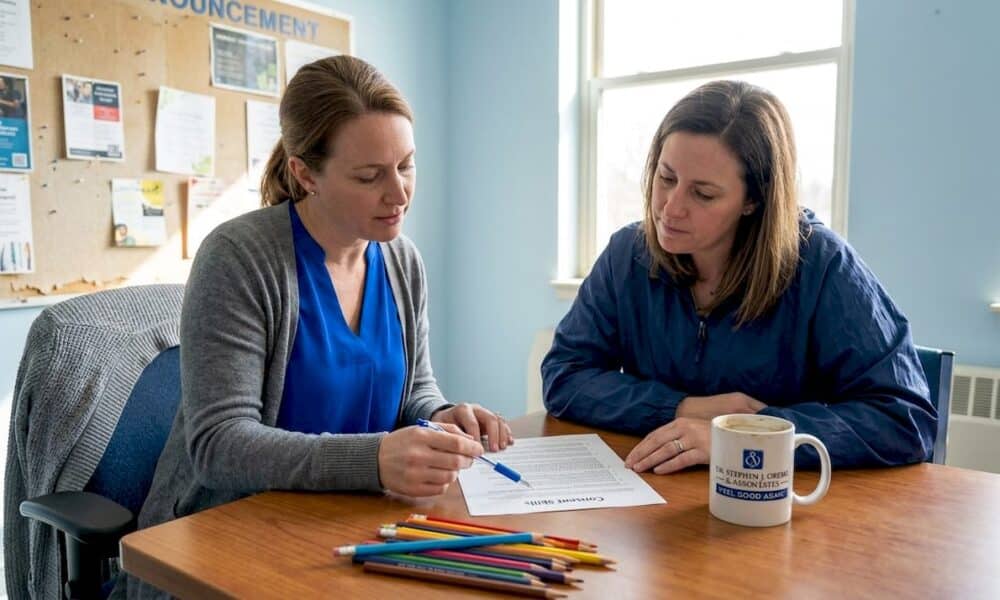 Educator and parent reviewing consent worksheet