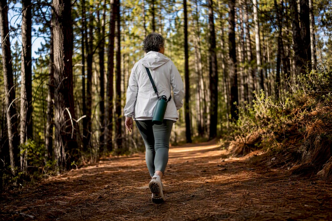 Person walking outdoors for mental health