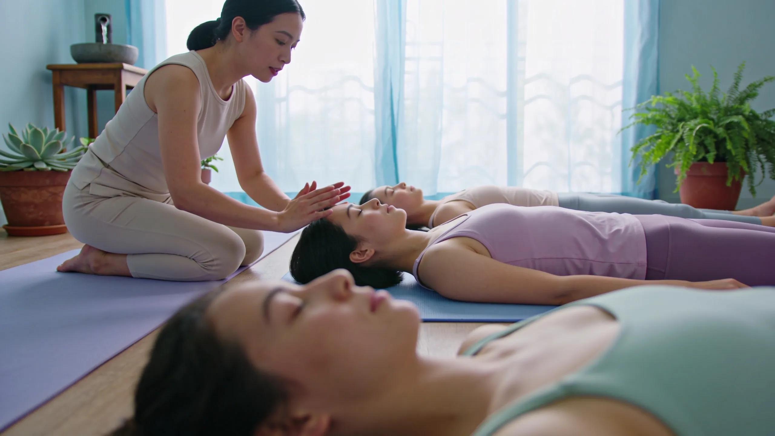 Instructor leading a body scan meditation in a peaceful setting, enhancing mindfulness and reducing anxiety.