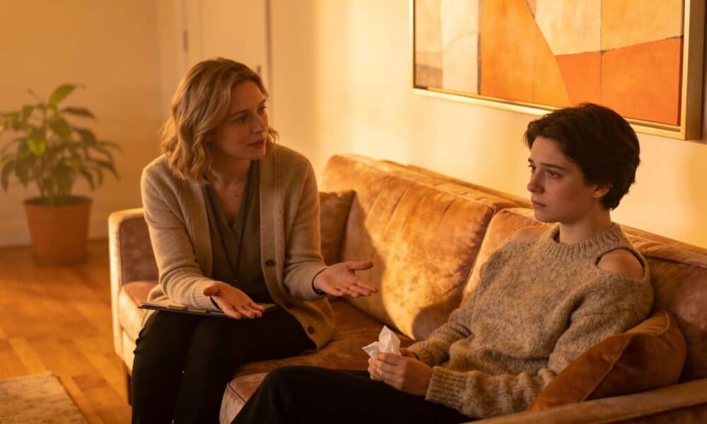Therapist and client in a warm therapy session, illustrating effective trauma support